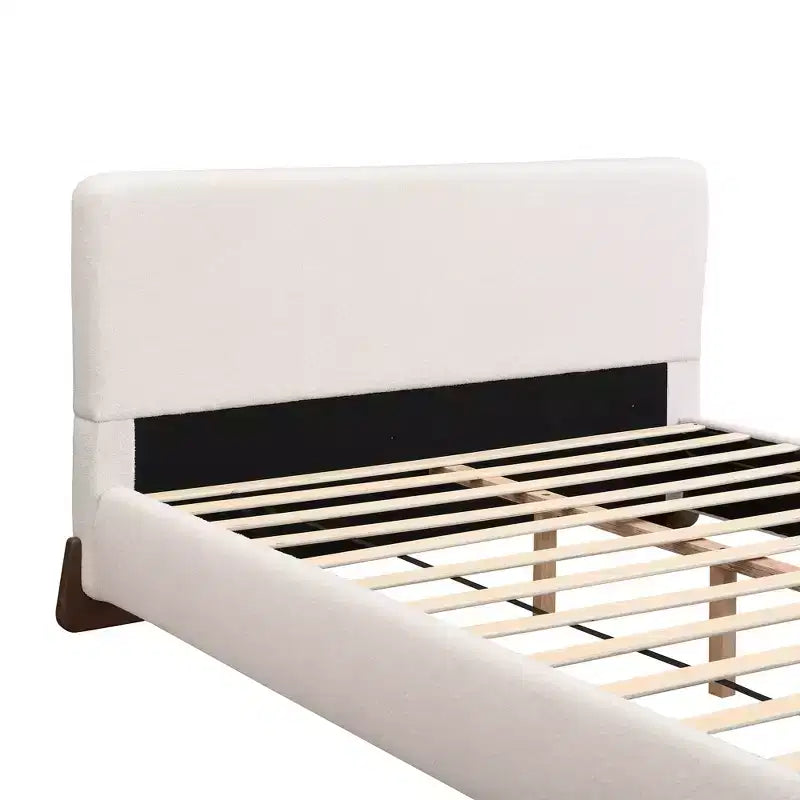 Lit capitonné en bois