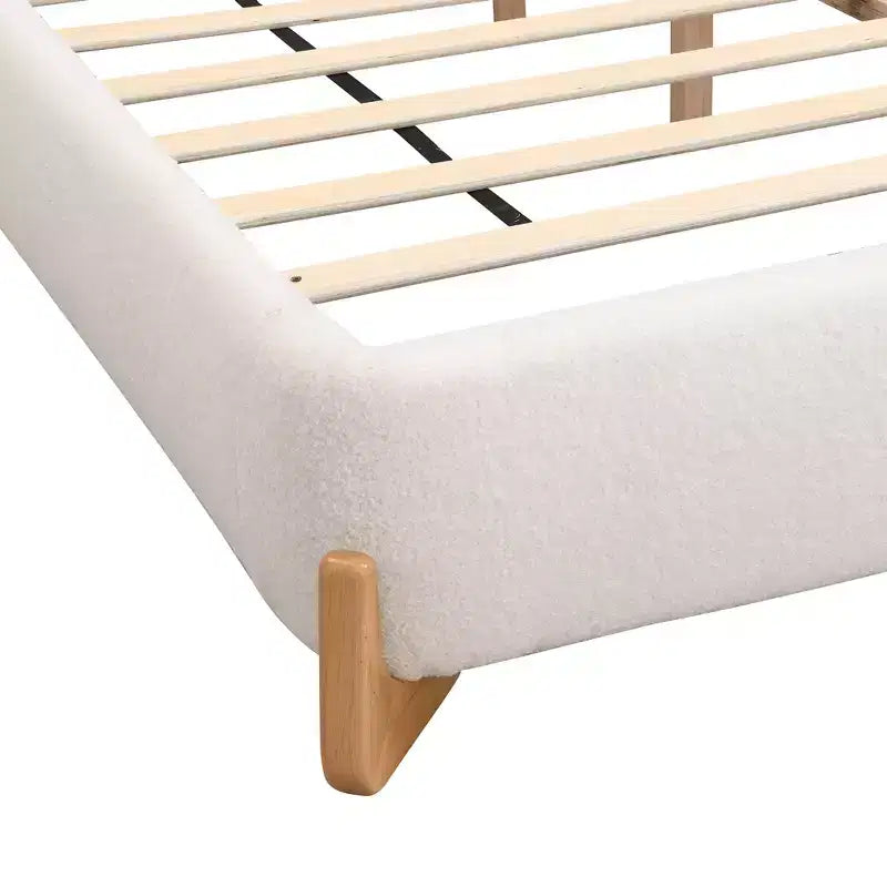 Lit capitonné en bois